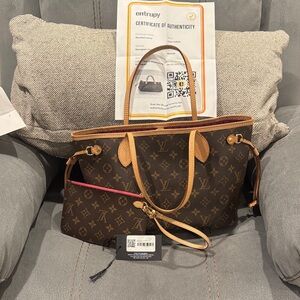 Louis Vuitton Designer leatherTote Bag with leather wristlet.